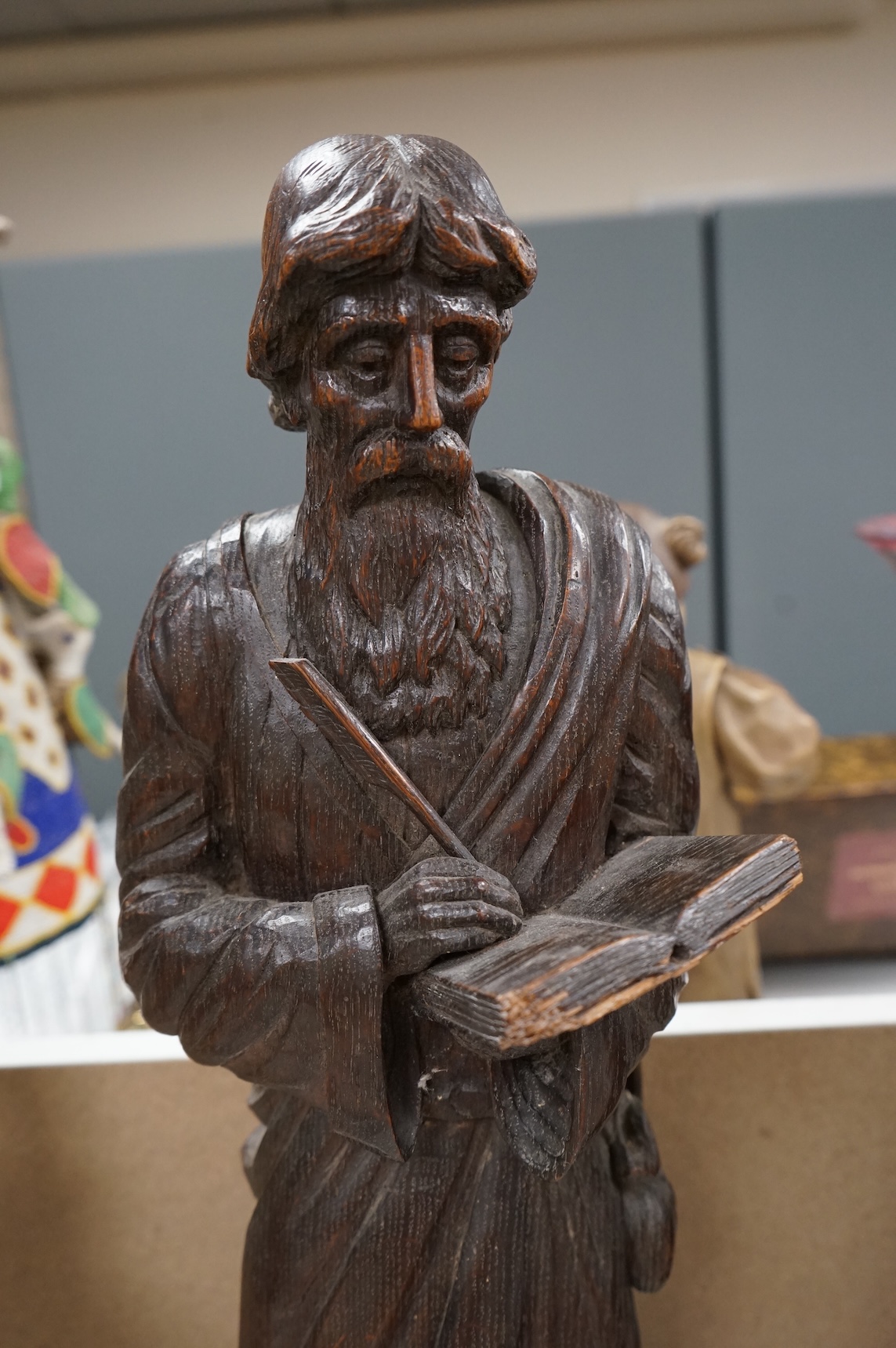 Two 19th century carved wood figures of standing scribes, 67cm